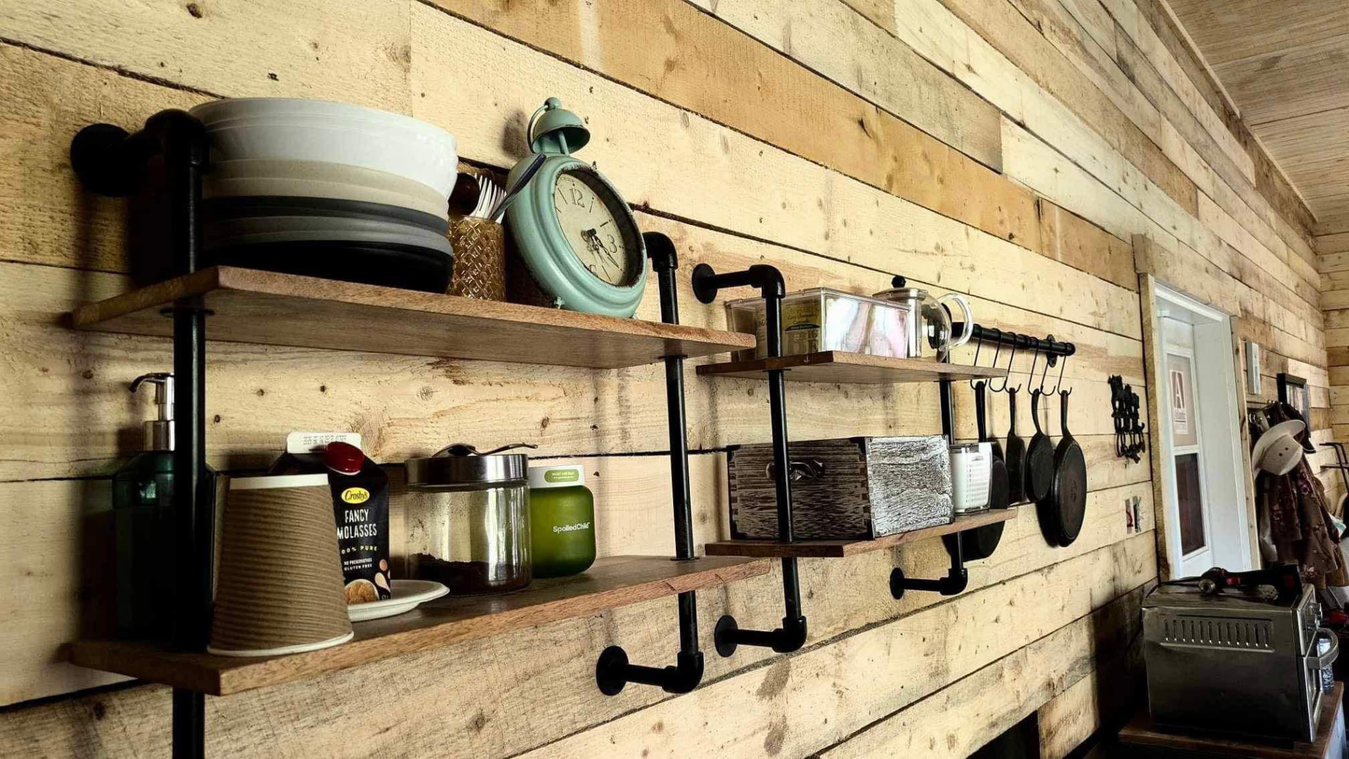 Rustic pipe shelving in the Cooper Lounge
