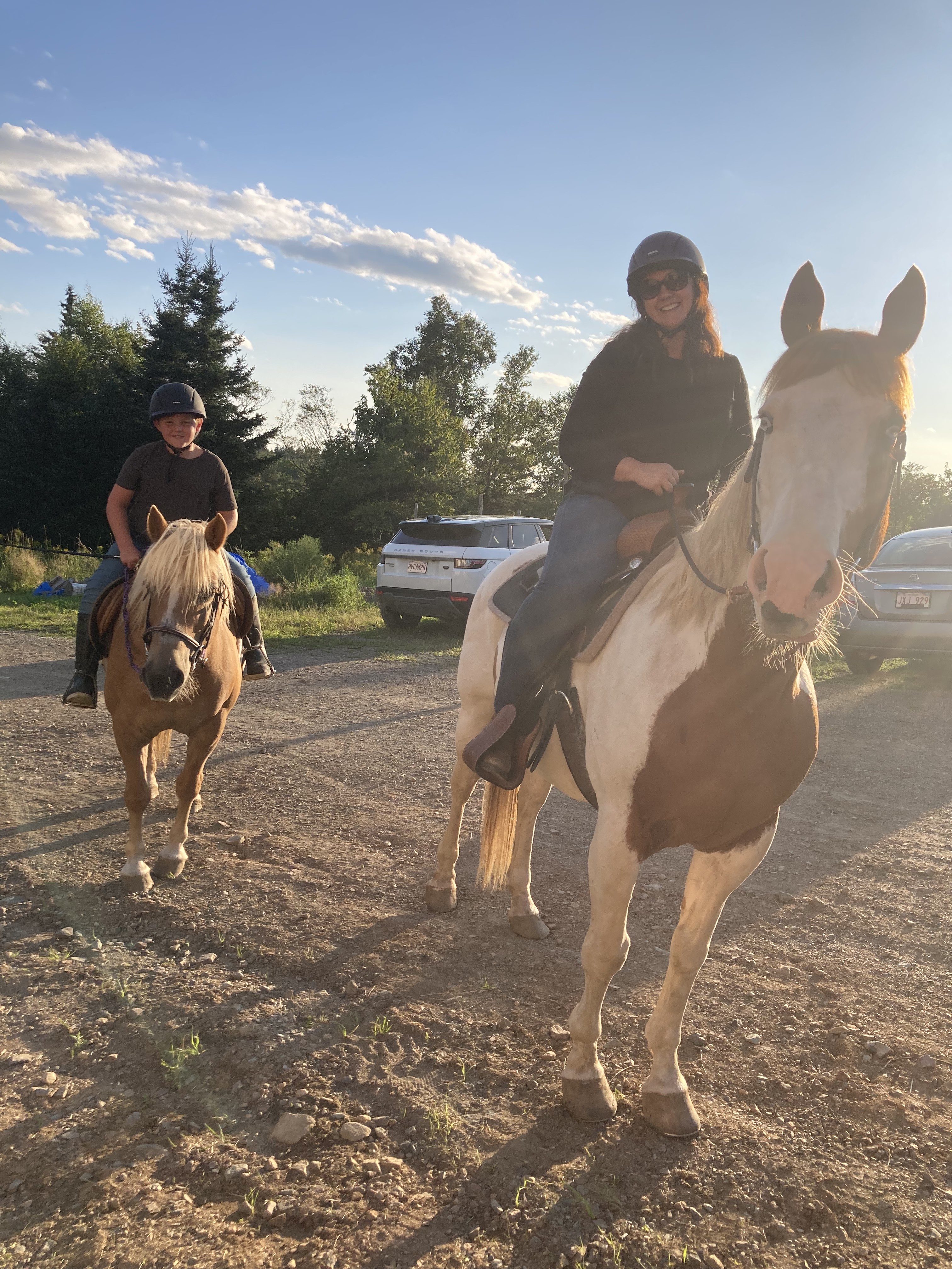 Mom and son mounted up and ready to head out on the trail